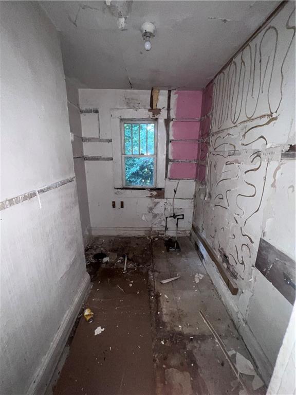 554 Nelson Street Macon, GA 31206 - Photo 36 of 37 a room with exposed radiator and a window