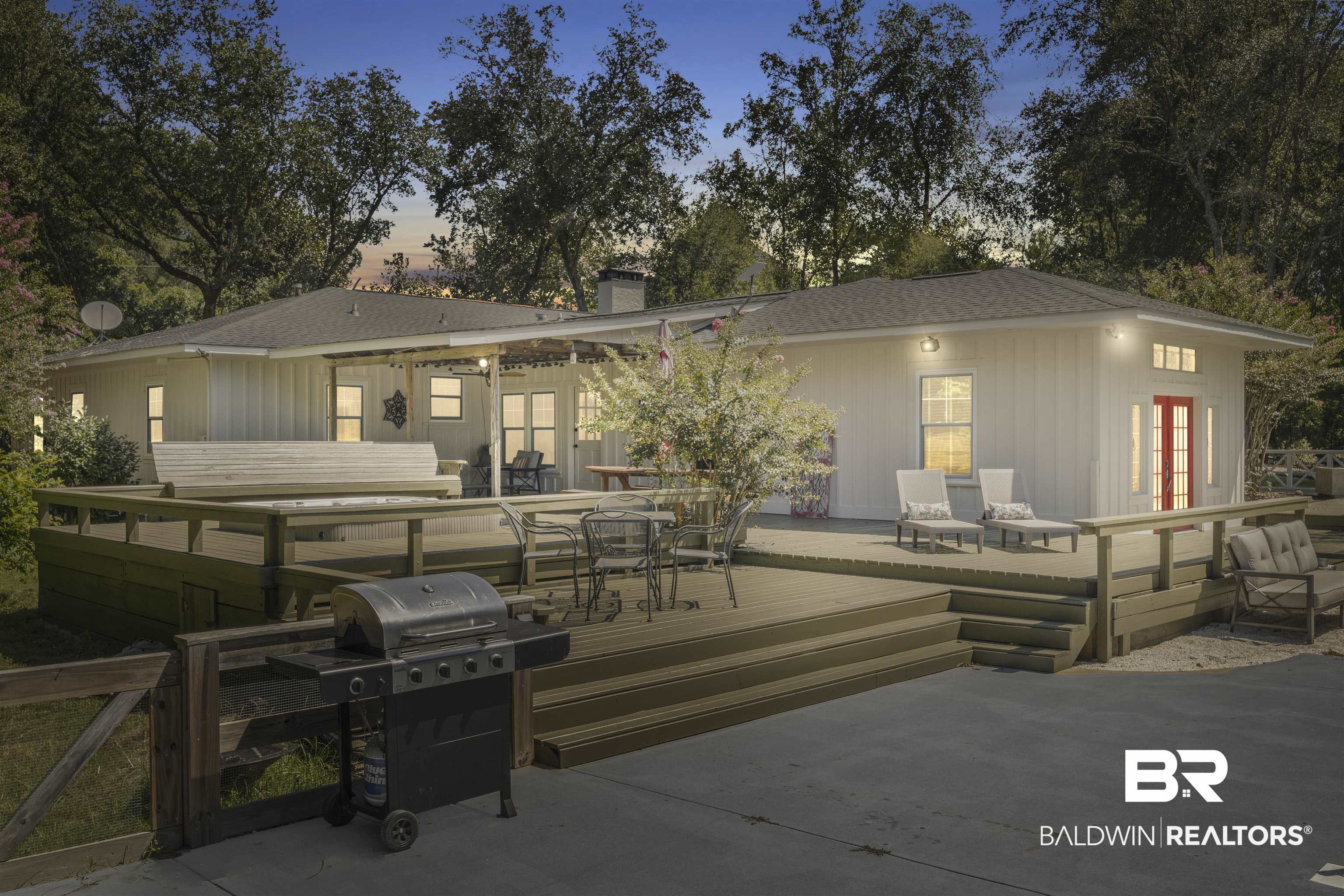 15100 Vasko Road Silverhill, AL 36576 - Photo 1 of 51 Back house at dusk with a deck