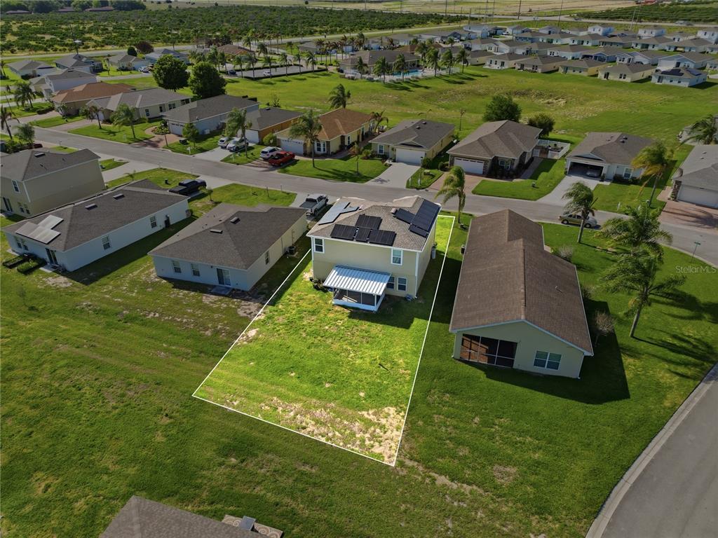 1637 Marble Street Sebring, FL 33870 - Photo 13 of 57 an aerial view of a house with garden space and ocean view