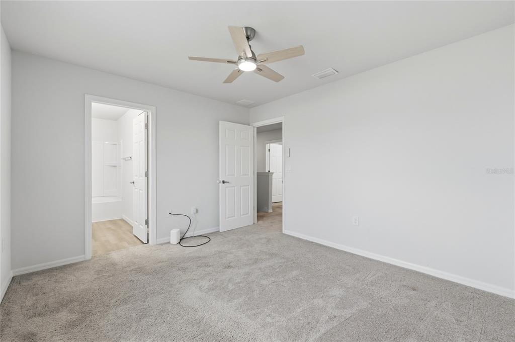 1637 Marble Street Sebring, FL 33870 - Photo 27 of 57 an empty room with ceiling fan and window
