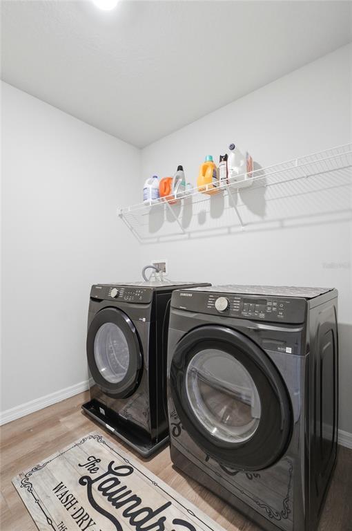 1637 Marble Street Sebring, FL 33870 - Photo 46 of 57 a utility room with dryer and washer