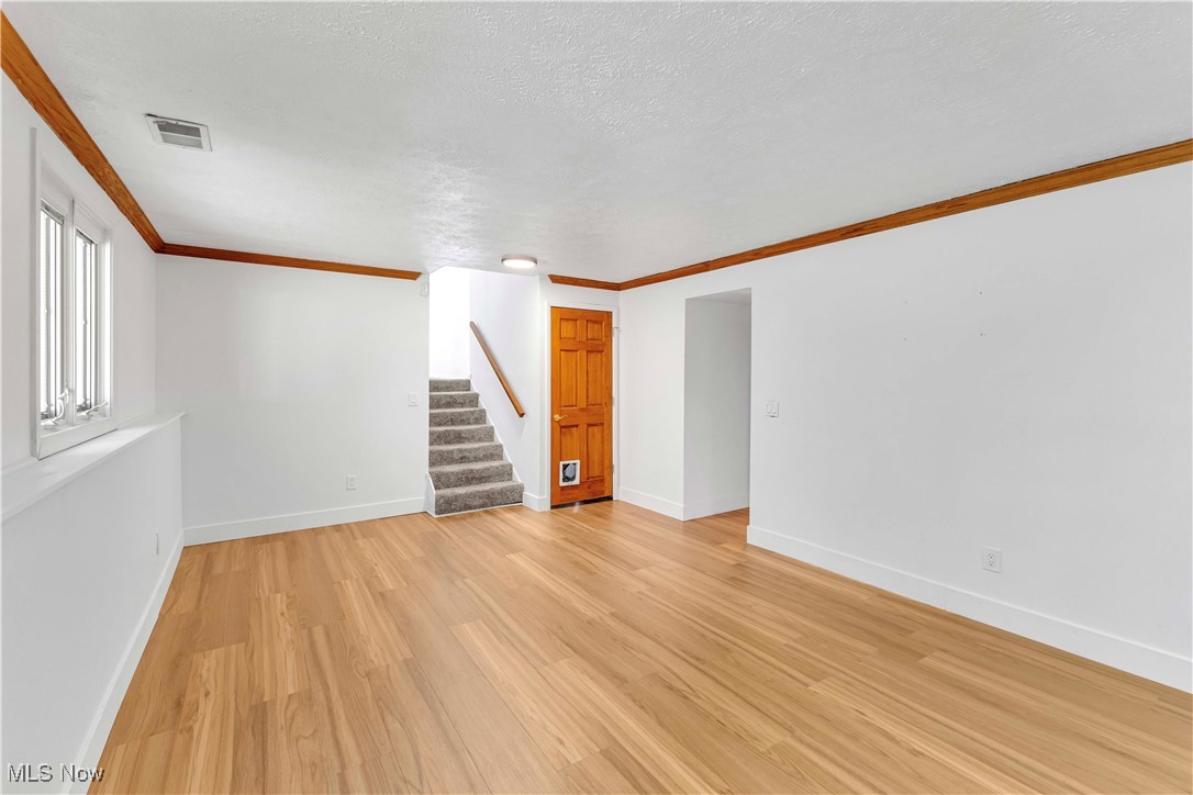 9544 Crackel Road Aurora, OH 44202 - Photo 23 of 42 Lower Level Family Room, Door to Basement