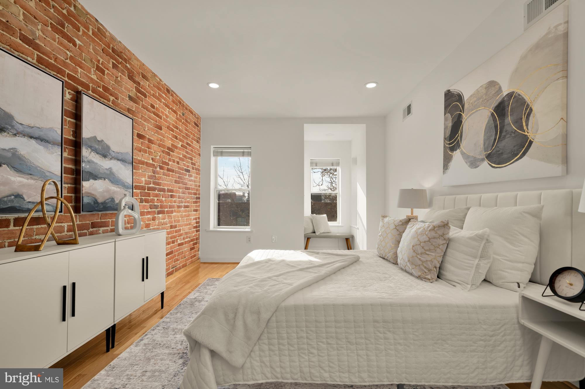706 L Street Southeast Washington, DC 20003 - Photo 14 of 36 a bedroom with a large bed and a window