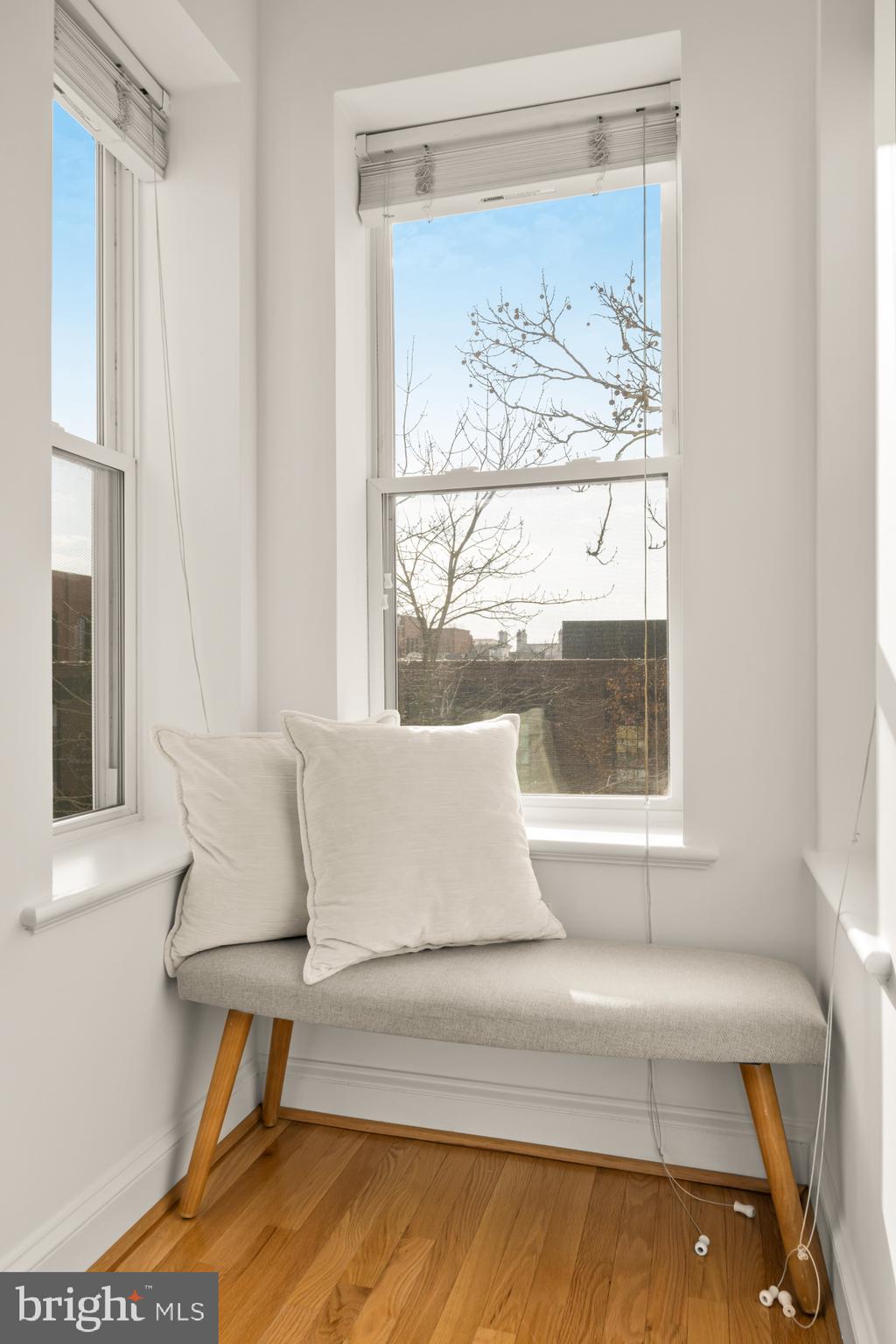706 L Street Southeast Washington, DC 20003 - Photo 16 of 36 a white bed sitting in a bathroom next to a window