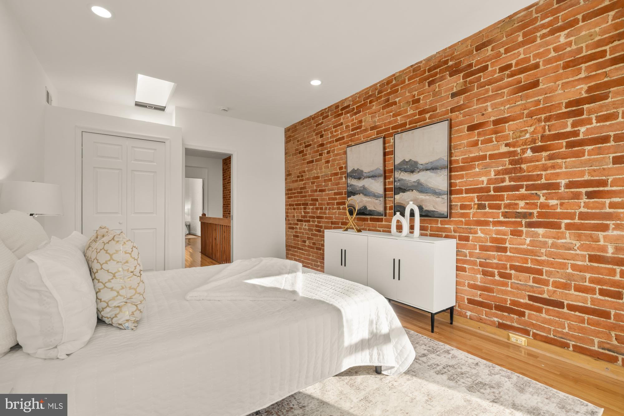 706 L Street Southeast Washington, DC 20003 - Photo 17 of 36 a bedroom with a bed and a flat screen tv