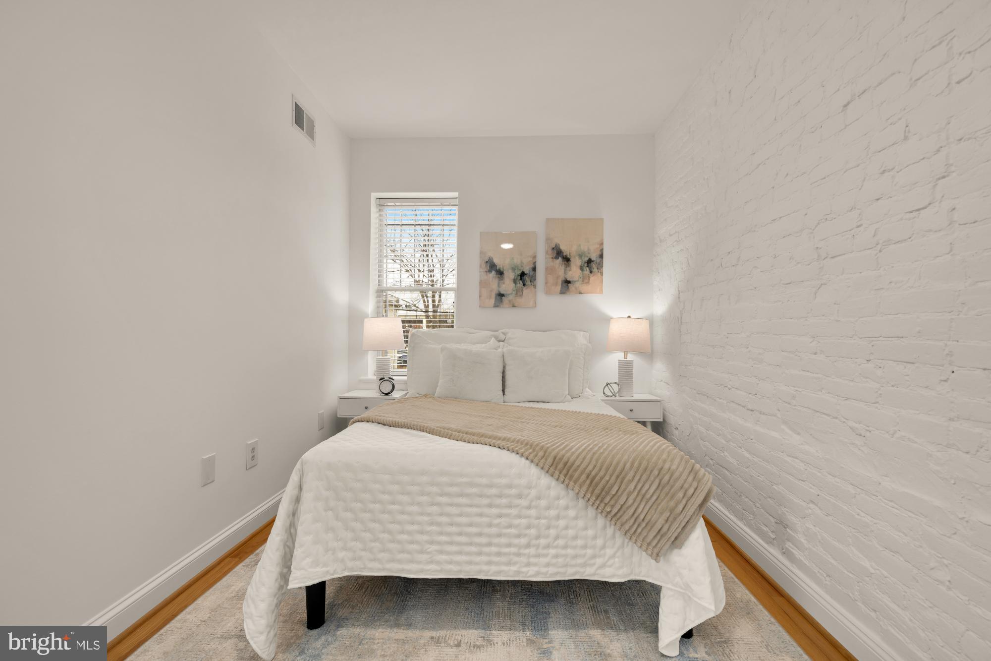 706 L Street Southeast Washington, DC 20003 - Photo 22 of 36 a bedroom with a bed and a window