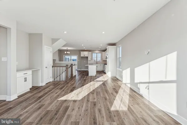 a large white bed in a white room