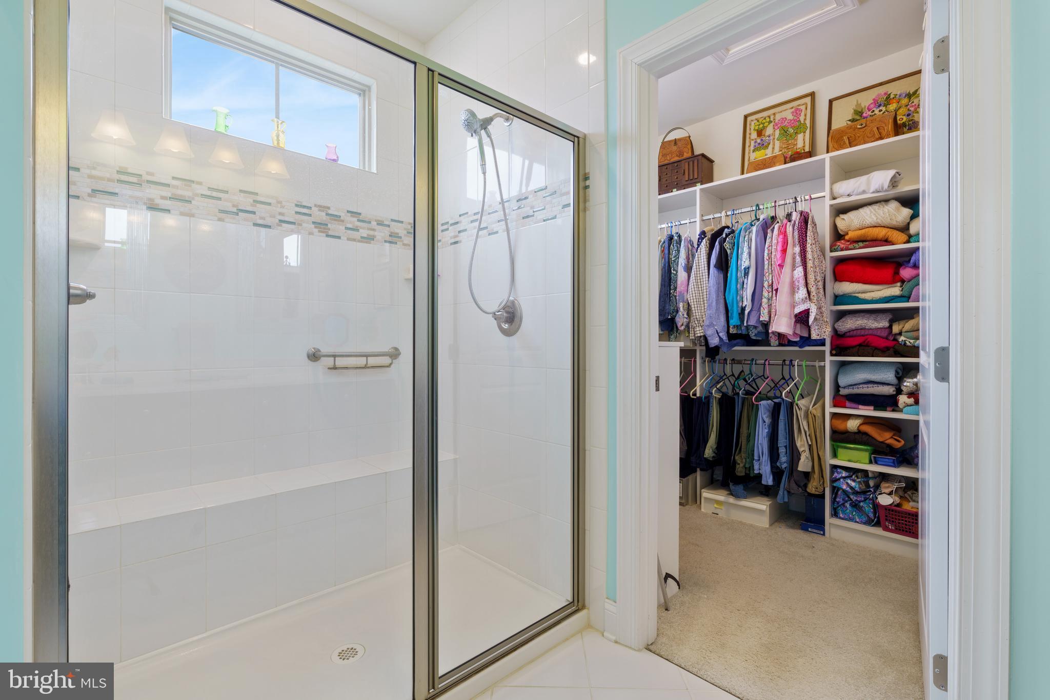6926 Summit Circle Baltimore, MD 21239 - Photo 21 of 52 a view of walk in closet with clothes and shoes