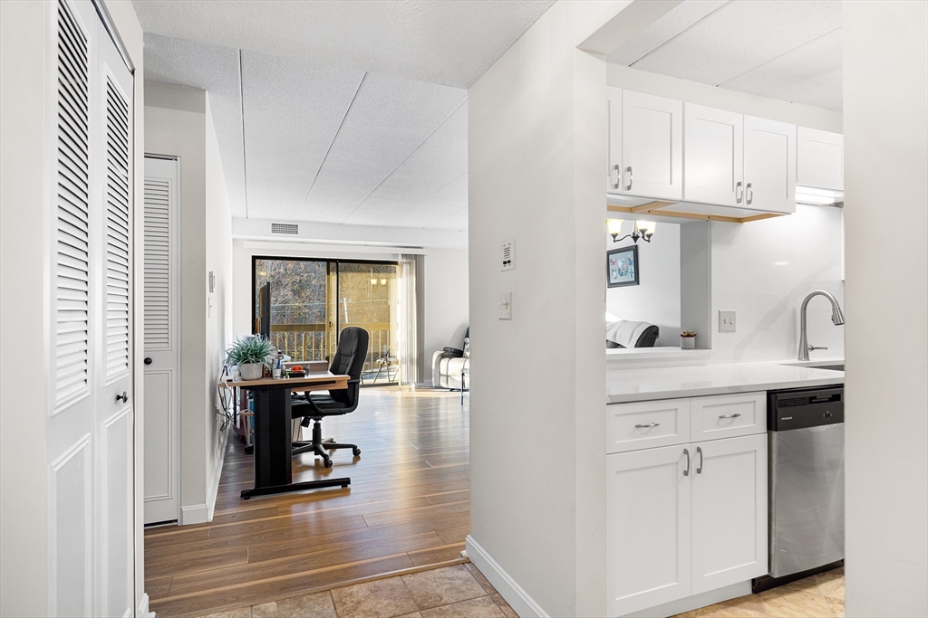 40 Main Street, Unit 505 Stoneham, MA 02180 - Photo 4 of 27 a kitchen with cabinets and window