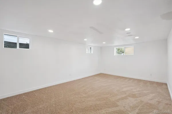 an empty room with a empty space and window