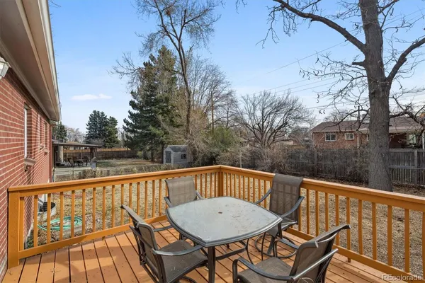 a view of a chairs and table on the deck
