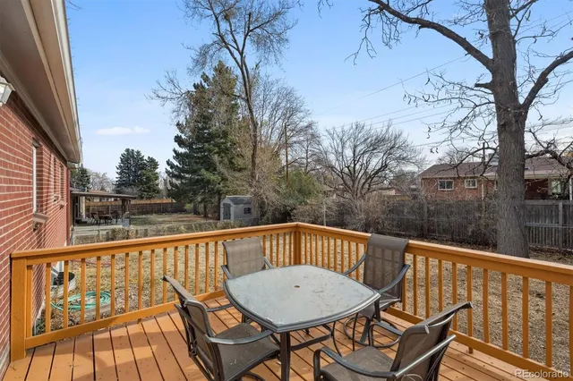 a view of a chairs and table on the deck