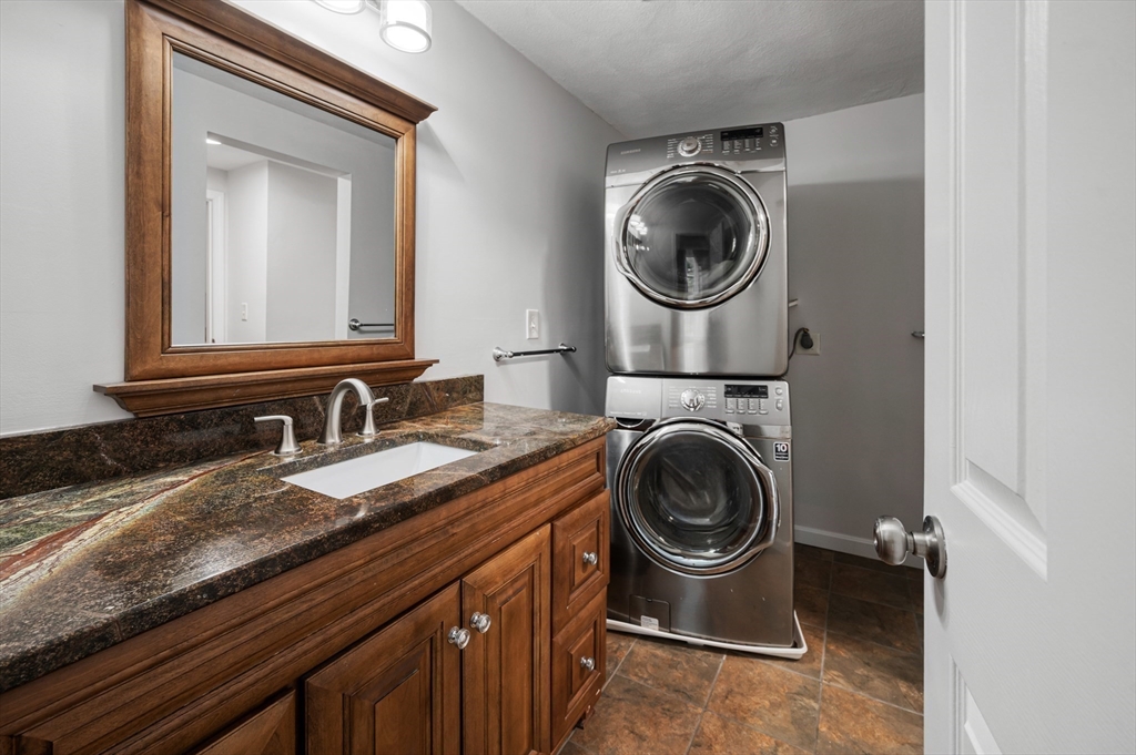 4 Deer Path, Unit 3 Maynard, MA 01754 - Photo 16 of 27 a utility room with sink dryer and washer