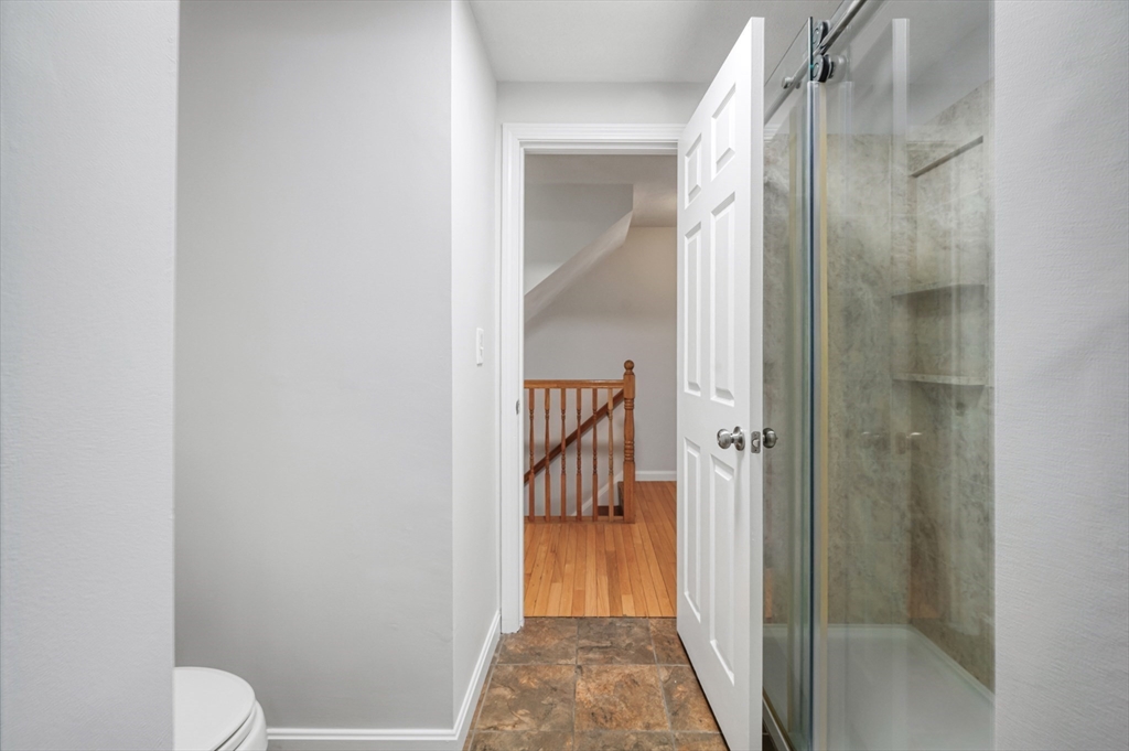 4 Deer Path, Unit 3 Maynard, MA 01754 - Photo 18 of 27 a bathroom with a shower and a toilet