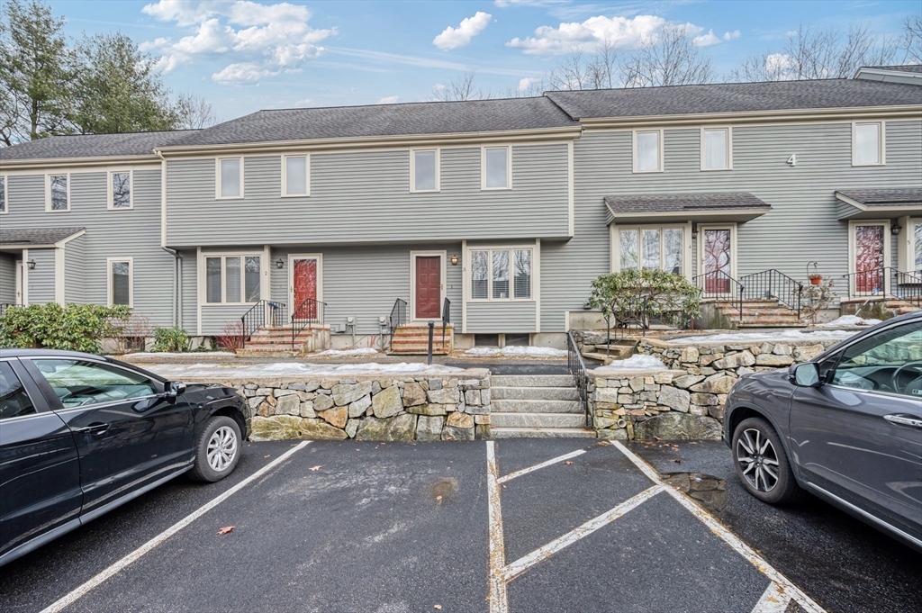 4 Deer Path, Unit 3 Maynard, MA 01754 - Photo 2 of 27 a front view of a house with parking space