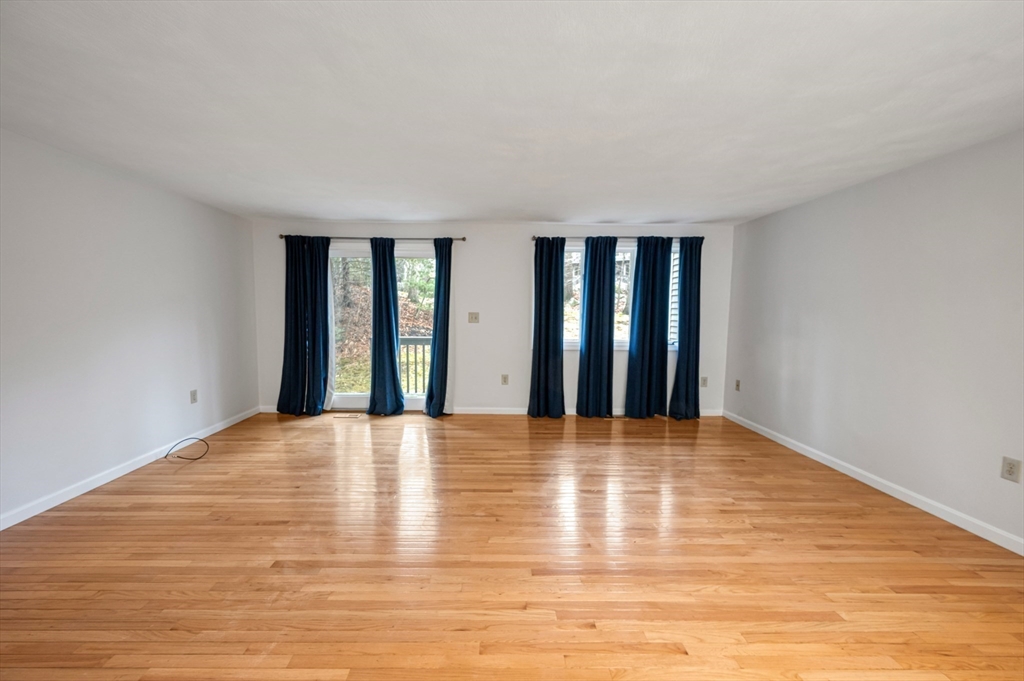 4 Deer Path, Unit 3 Maynard, MA 01754 - Photo 7 of 27 a view of an empty room with wooden floor