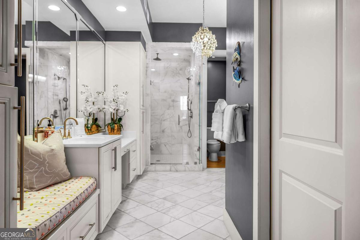 8 18th Street Tybee Island, GA 31328 - Photo 30 of 50 a bathroom with a tub sink and mirror