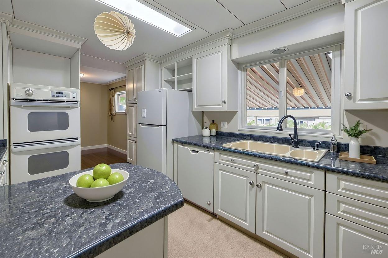 56 Club View Drive Novato, CA 94949 - Photo 2 of 27 a kitchen with cabinets and window