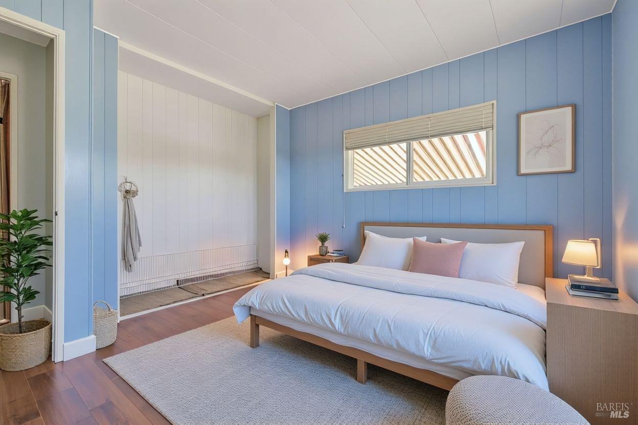 56 Club View Drive Novato, CA 94949 - Photo 5 of 27 a bedroom with a bed and wooden floor