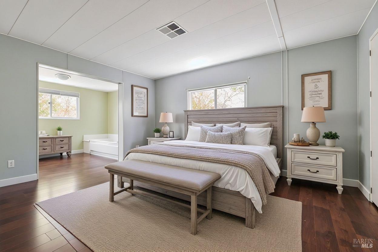 56 Club View Drive Novato, CA 94949 - Photo 6 of 27 a bedroom with a bed and a table in it