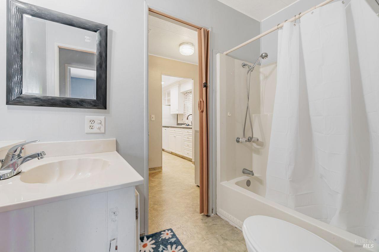 56 Club View Drive Novato, CA 94949 - Photo 7 of 27 a bathroom with a sink toilet and shower