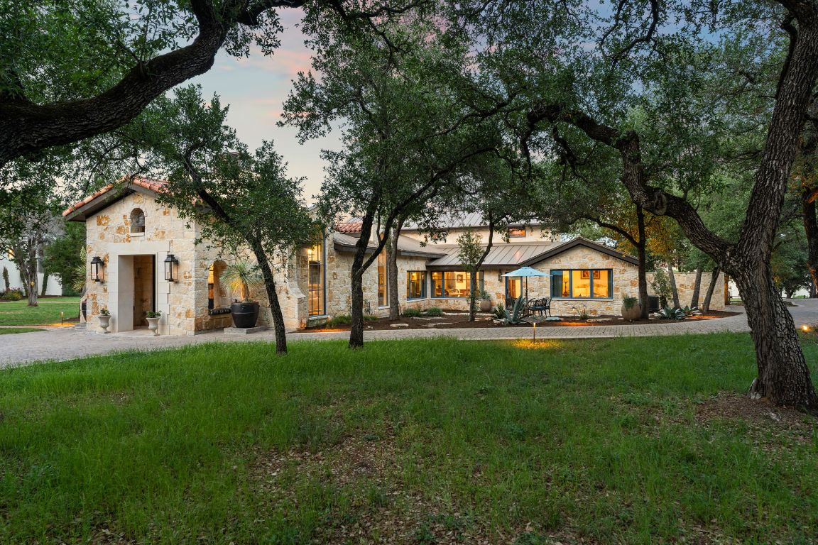 11941 Overlook Pass Austin, TX 78738 - Photo 1 of 1 a view of a house with a big yard and large trees
