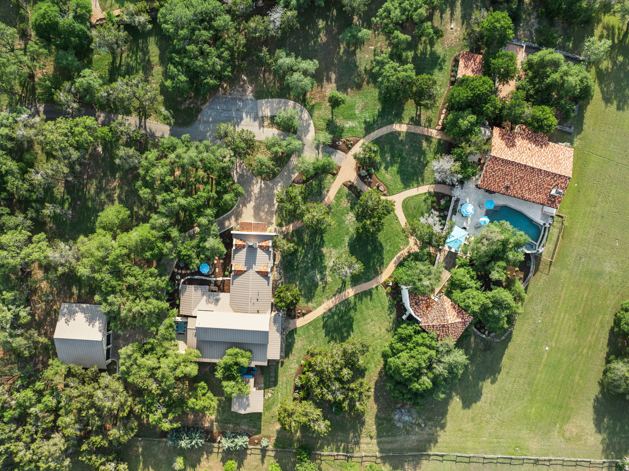 11941 Overlook Pass Austin, TX 78738 - Photo 2 of 38 an aerial view of a house with a yard and garden