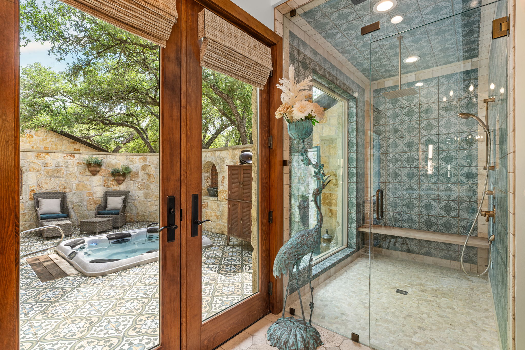 11941 Overlook Pass Austin, TX 78738 - Photo 23 of 38 a bathroom with a glass shower door and mirror