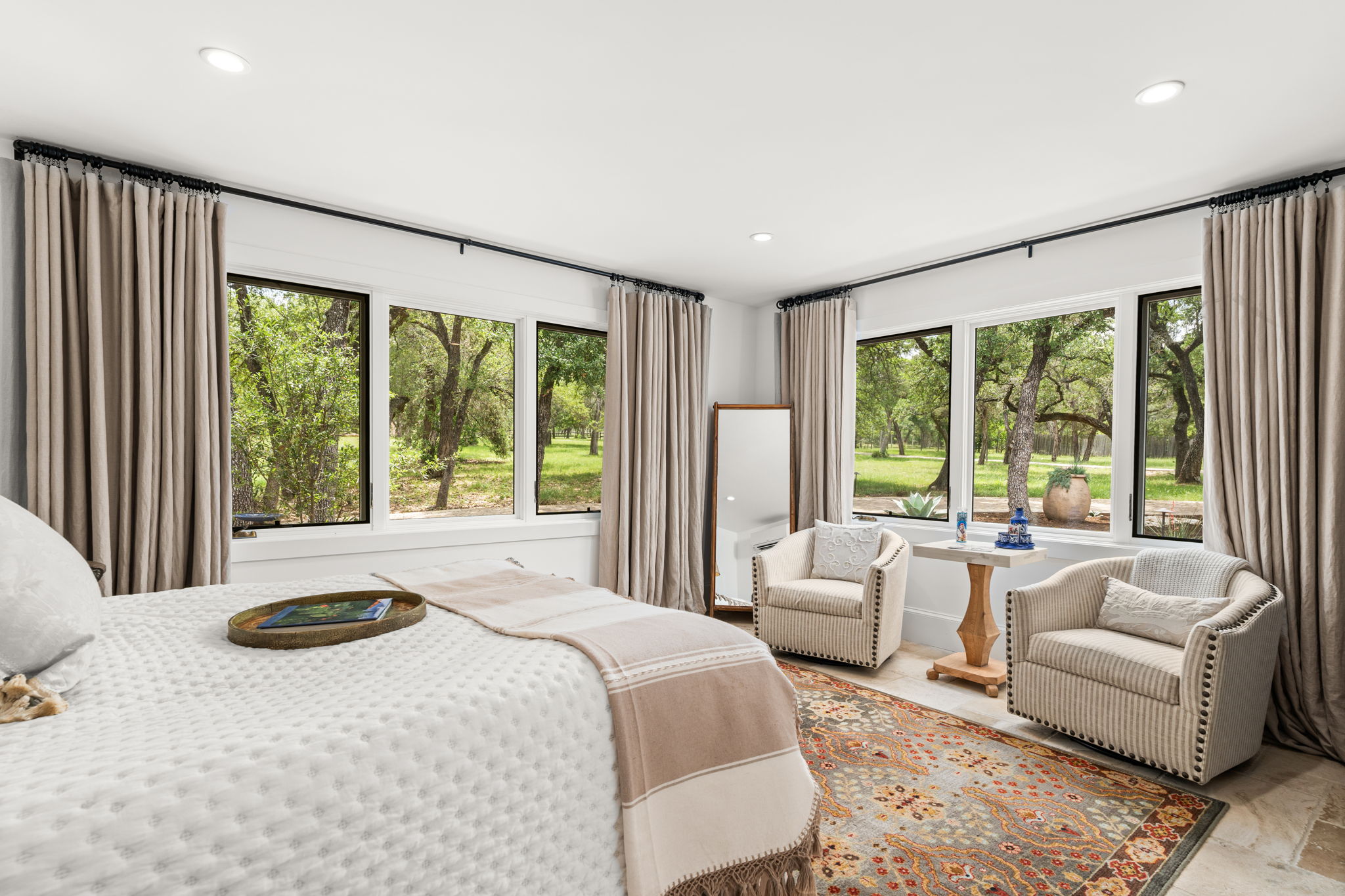 11941 Overlook Pass Austin, TX 78738 - Photo 27 of 38 a bedroom with a large bed and a large window