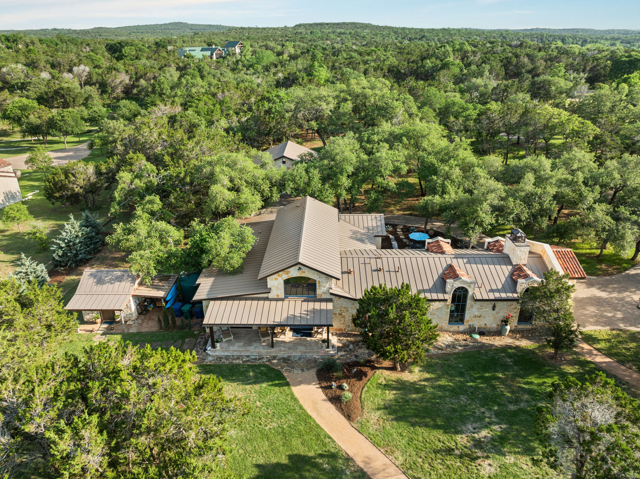11941 Overlook Pass Austin, TX 78738 - Photo 32 of 38 an aerial view of a house with swimming pool and garden