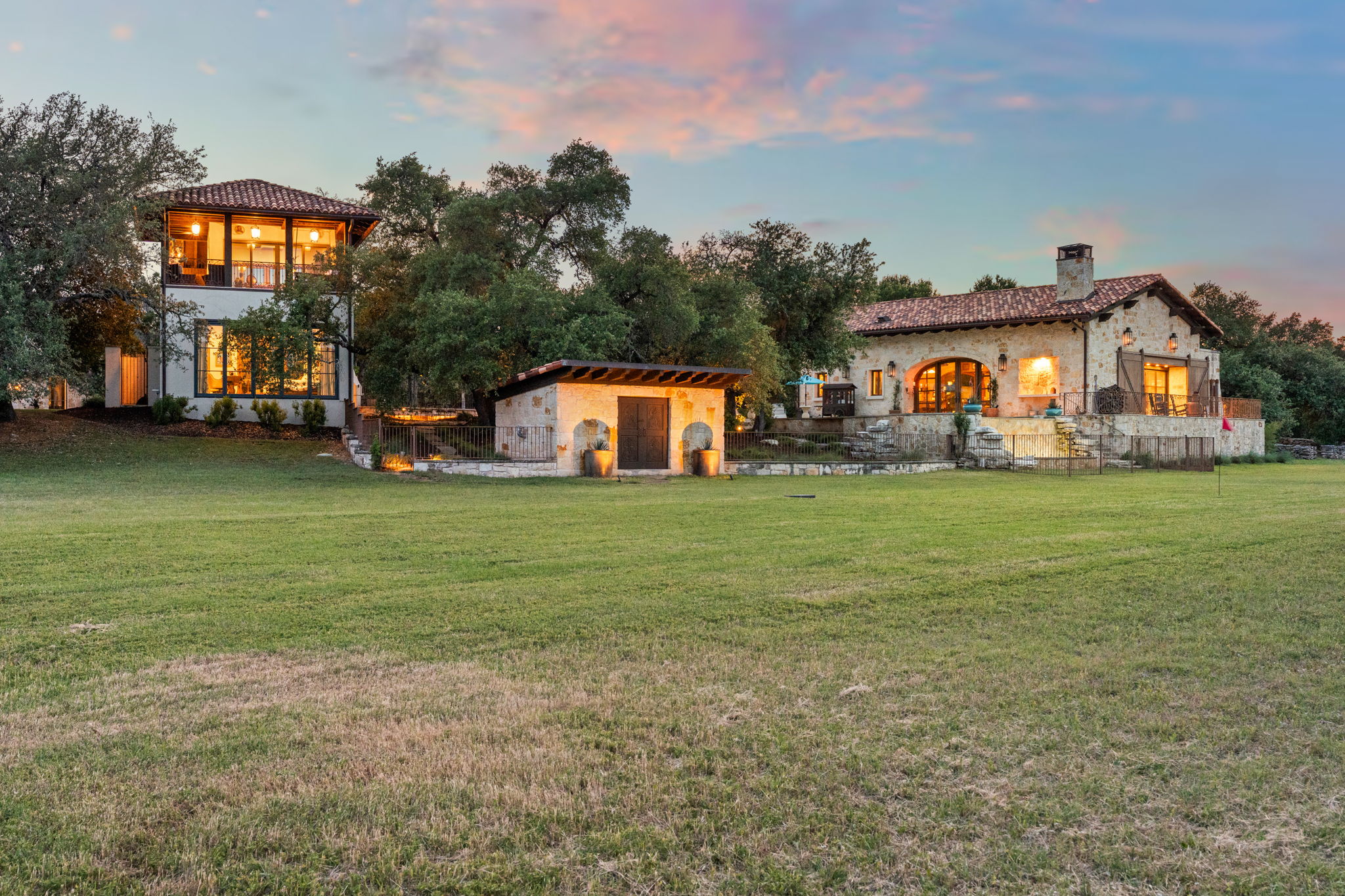 11941 Overlook Pass Austin, TX 78738 - Photo 33 of 38 a view of a white house with a big yard and large trees