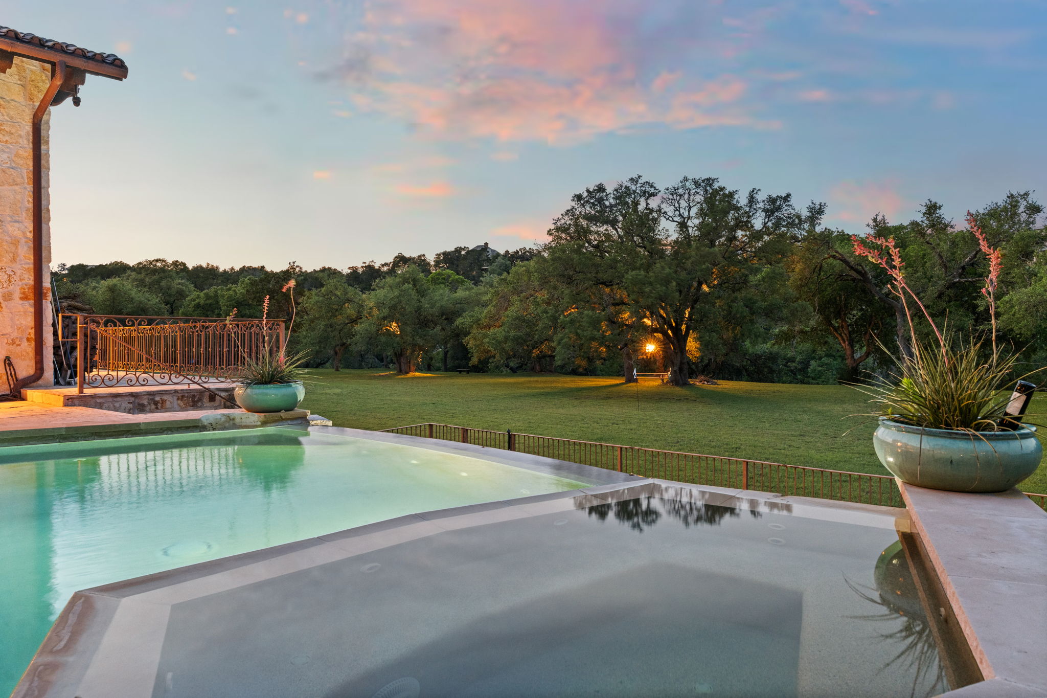 11941 Overlook Pass Austin, TX 78738 - Photo 10 of 38 a view of a swimming pool with a garden and trees