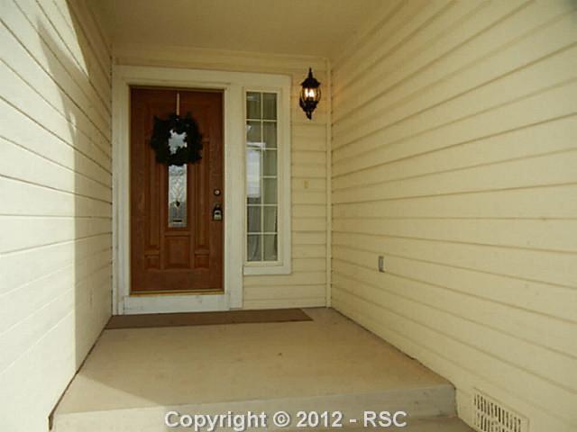 8121 Fort Smith Road Peyton, CO 80831 - Photo 12 of 17 COVERED ENTRY