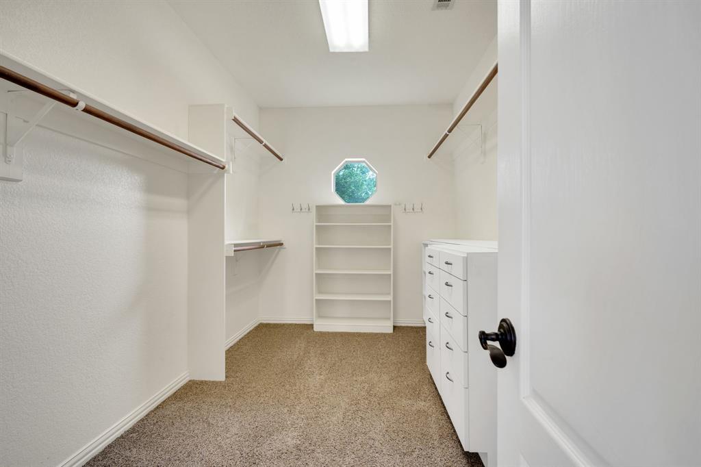 241 Cody Road Ennis, TX 75119 - Photo 21 of 40 Primary closet in bathroom
