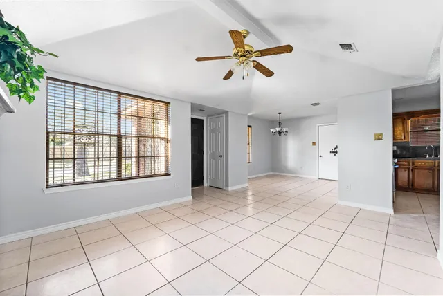 a view of an empty room and window