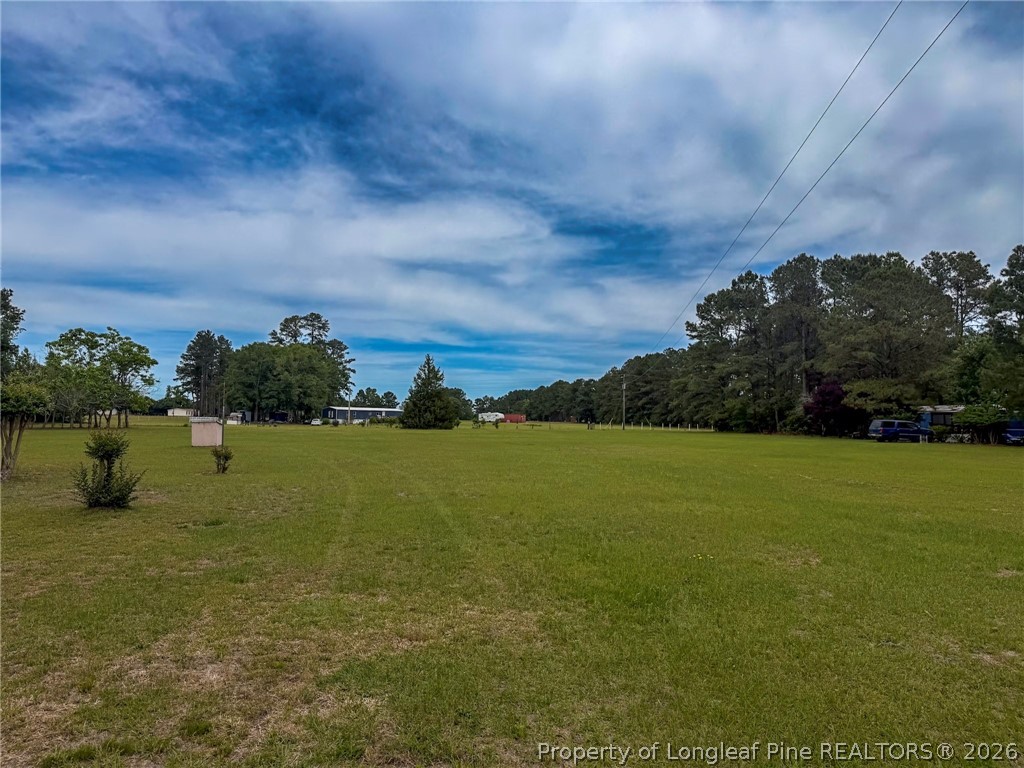 1308 Mac D Road Orrum, NC 28369 - Photo 5 of 32 a view of an ocean from a yard