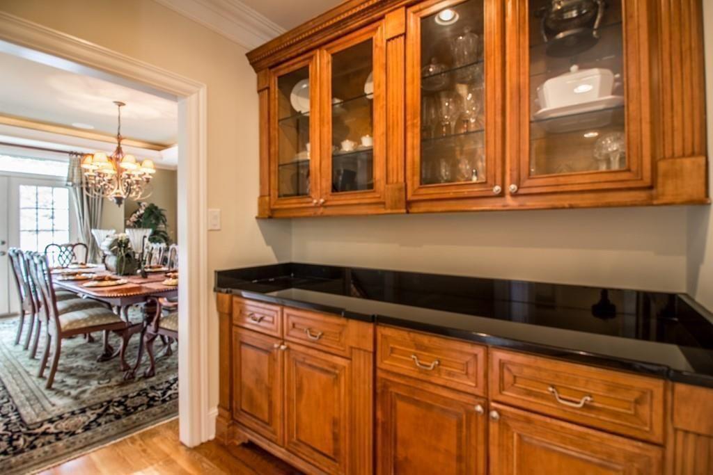 4064 Lyon Boulevard Southwest Atlanta, GA 30331 - Photo 15 of 38 a kitchen with granite countertop a sink and cabinets