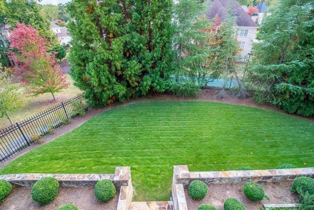 4064 Lyon Boulevard Southwest Atlanta, GA 30331 - Photo 16 of 38 a backyard of a house with lots of green space