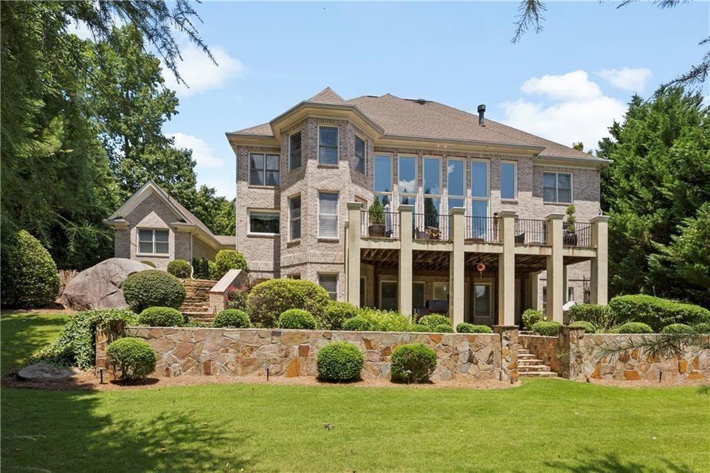 4064 Lyon Boulevard Southwest Atlanta, GA 30331 - Photo 2 of 38 a front view of a house with a yard
