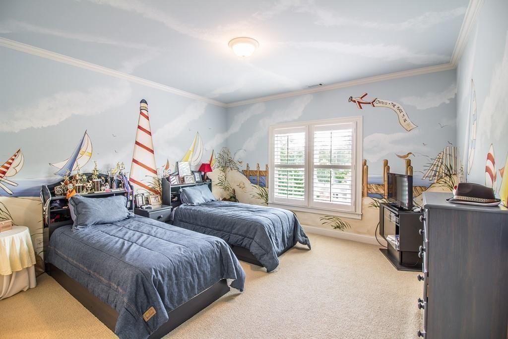 4064 Lyon Boulevard Southwest Atlanta, GA 30331 - Photo 23 of 38 a spacious bedroom with two beds and a large window