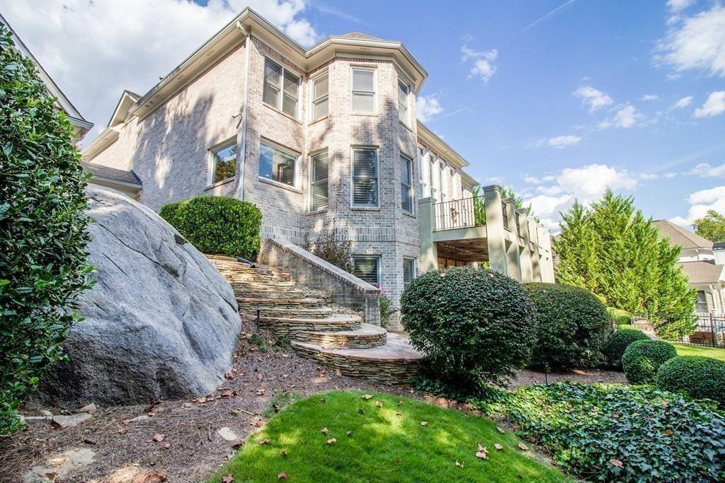 4064 Lyon Boulevard Southwest Atlanta, GA 30331 - Photo 31 of 38 a view of a brick house with a yard