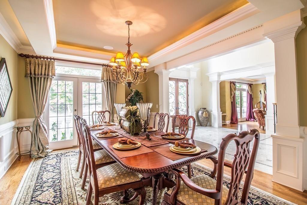4064 Lyon Boulevard Southwest Atlanta, GA 30331 - Photo 9 of 38 a view of a dining room with furniture wooden floor and chandelier