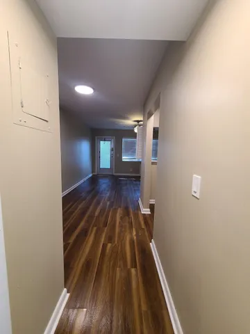 a view of entryway with wooden floor