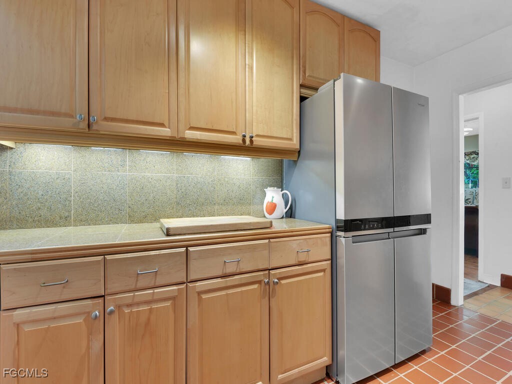 1803 Ardmore Road Fort Myers, FL 33901 - Photo 13 of 39 a white refrigerator freezer sitting inside of a kitchen