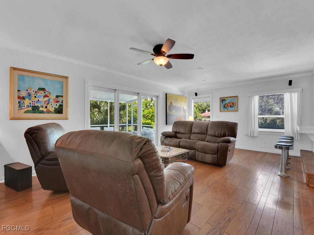 1803 Ardmore Road Fort Myers, FL 33901 - Photo 15 of 39 a living room with furniture a ceiling fan a lamp and a window