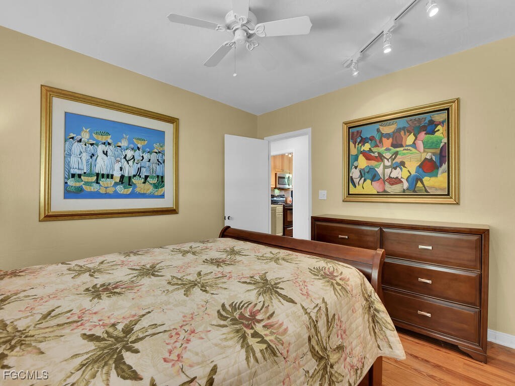 1803 Ardmore Road Fort Myers, FL 33901 - Photo 29 of 39 a bedroom with a bed and a painting on the wall