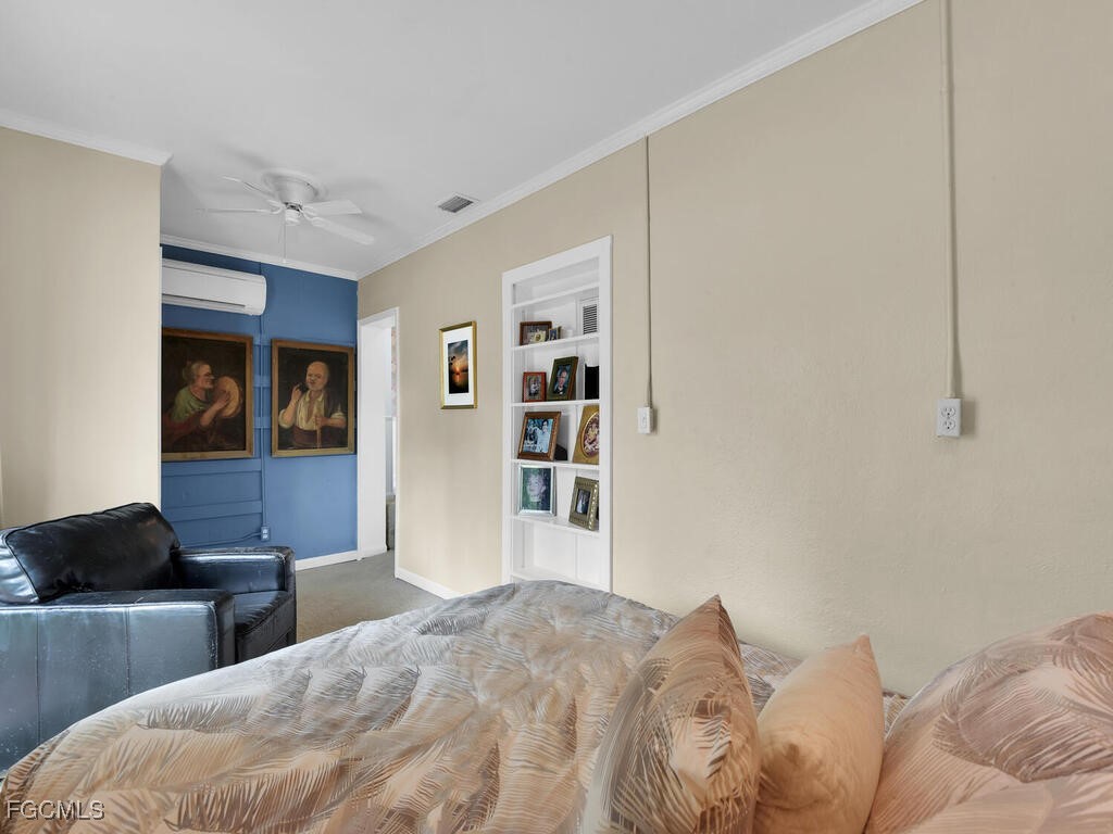 1803 Ardmore Road Fort Myers, FL 33901 - Photo 31 of 39 a bedroom with a bed and cabinets