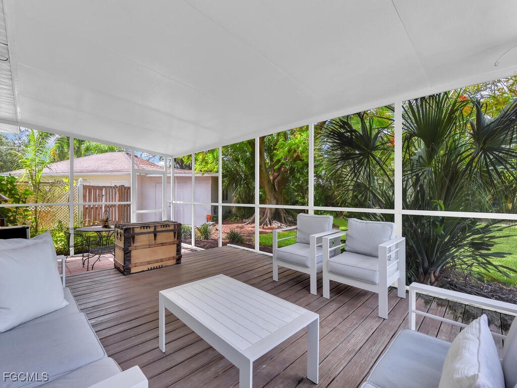 1803 Ardmore Road Fort Myers, FL 33901 - Photo 34 of 39 a balcony with wooden floor and outdoor seating
