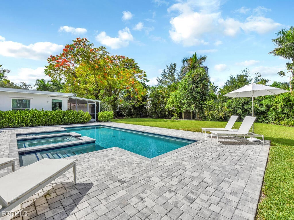 1803 Ardmore Road Fort Myers, FL 33901 - Photo 35 of 39 a view of a house with a swimming pool and sitting area