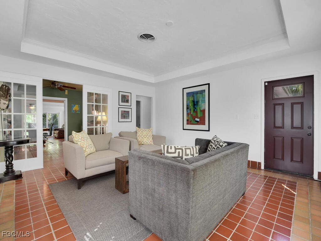 1803 Ardmore Road Fort Myers, FL 33901 - Photo 6 of 39 a living room with furniture and a rug